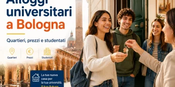 Studenti universitari ricevono le chiavi di un alloggio a Bologna, guida a quartieri, prezzi e studentati